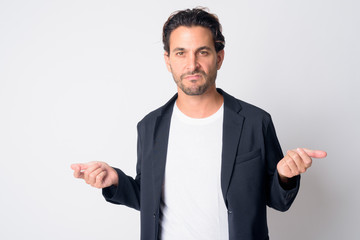 Portrait of stressed Hispanic businessman looking angry with arms raised