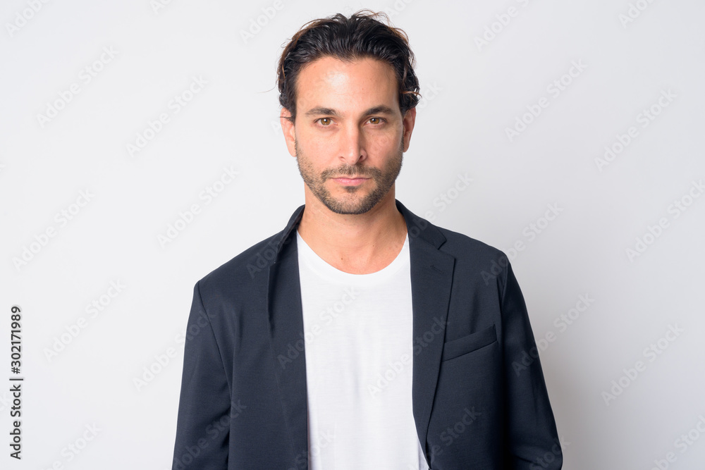 Wall mural face of handsome hispanic businessman looking at camera