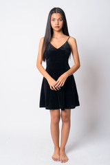 Full body shot of young beautiful Asian woman