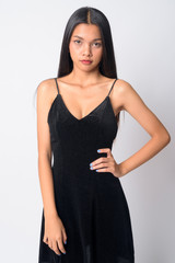 Naklejka premium Portrait of young beautiful Asian woman looking at camera