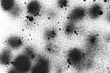 Spray black texture with paint leaks and splashes on the white isolated background.