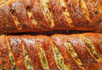 Beautiful delicious looking stuffed pastry bread decorated with seeds, cooked homemade for healthy nutritious meal or snack