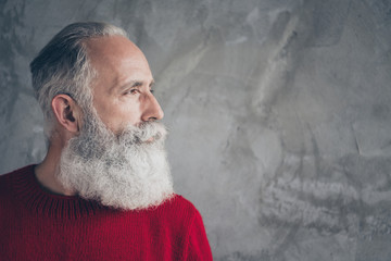 Closeup photo of nice aged guy looking side empty space minded wear red knitted pullover jumper...