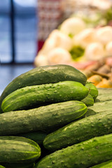 Fresh cucumber in supermarket. Concept of healthy food, bio, vegetarian, diet.