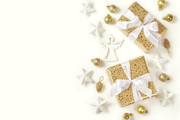Christmas decoration and golden gift boxes on white background.