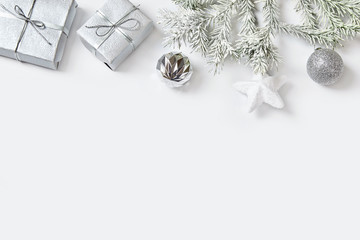 Christmas ball and presents with ribbon on white background.