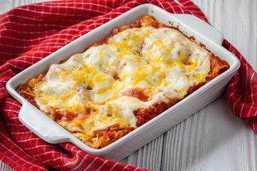 Spinach and ricotta stuffed cannelloni baked  in tomato sauce.