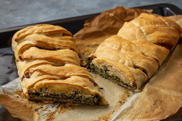 Homemade savory braided puff pastry with spinach and ricotta filling. 