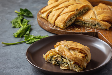 Homemade savory braided puff pastry with spinach and ricotta filling. 