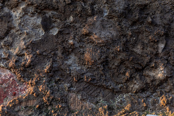 Wall fragment with scratches and cracks