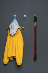 uniform for nordic walking hanging on a hanger, on a gray background.