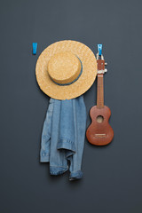 ukulele,denim jacket, straw hat on the background