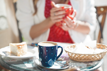 Closeup portrait of young beautiful woman wearing red beret. Attractive female outdoors like in France. French girl.