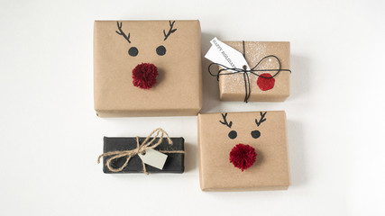 New Year's Christmas stylishly decorated handmade gifts on a light background.