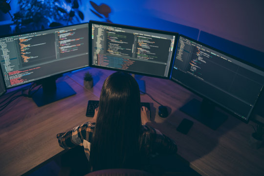 Back rear top above high angle view photo of coder debugging protection software of her corporation removing failures and errors