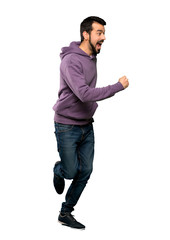 Naklejka premium Handsome man with sweatshirt running fast