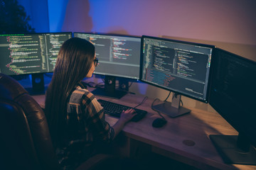 Photo of focused concentrated serious programmer searching for mistakes errors in code to debug and solve them