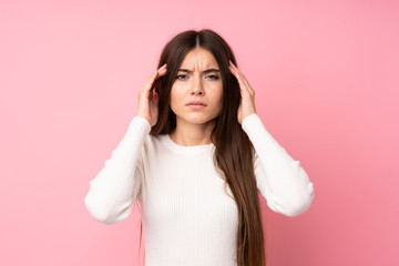 Young woman over isolated pink background unhappy and frustrated with something. Negative facial...