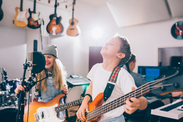 kids rock band in music studio