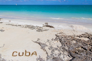   Inscription on the beach sand .Cuba.Horizontally.
