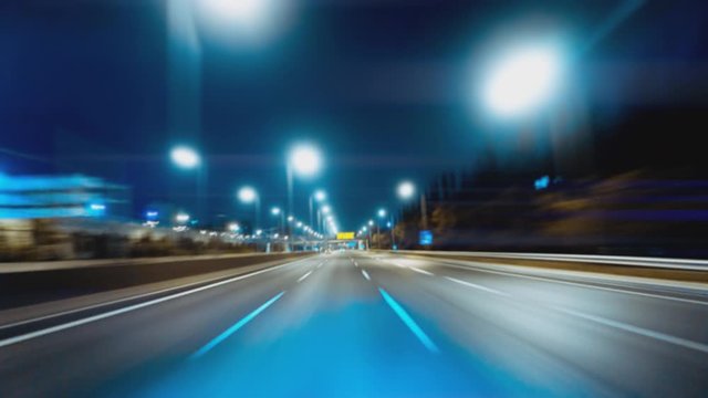 Driving hyperlapse pov on a bright futuristic highway night with endless twists, turns, and tunnels at high speeds.