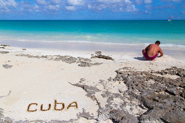 Fototapeta na wymiar Inscription on the beach sand .Cuba.Horizontally.