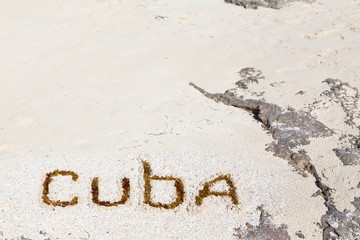   Inscription on the beach sand .Cuba.Horizontally.