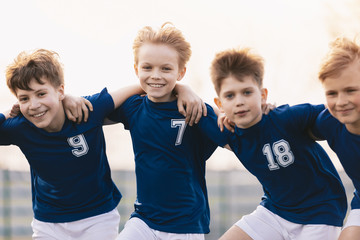 Happy Friends on a Soccer Team. Boys Sports Players Having Fun. Kids Soccer Players Cheering...
