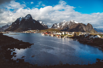 Norway rorbu houses and mountains rocks over fjord landscape scandinavian travel view Lofoten islands. Natural scandinavian landscape.