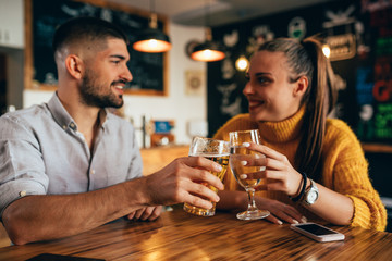 friends making a toast in bar