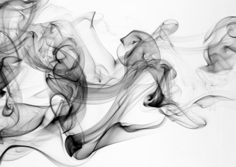 Black smoke on white background. movement of smoke abstract fire design