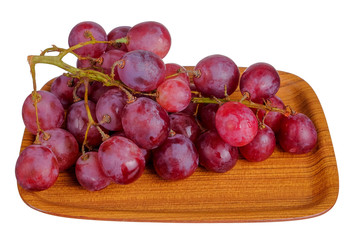 Fresh bunch of grapes on plate isolated on white background