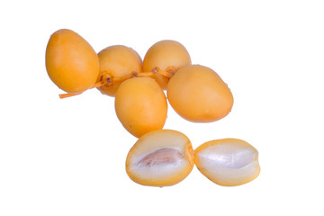 Yellow raw date palm isolated on white background.