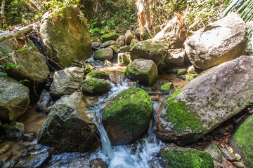 Kathu Waterfall in the tropical forest area In Asia, suitable for walks, nature walks and hiking, adventure photography Of the national park Phuket Thailand,Suitable for travel and leisure.