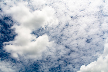 Obraz premium The clouds gather and the blue sky during the rainy season in Thailand.