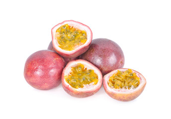 whole and half cut ripe passion fruit on white background