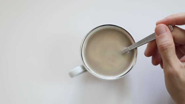 cup of tasty coffee and ground coffee