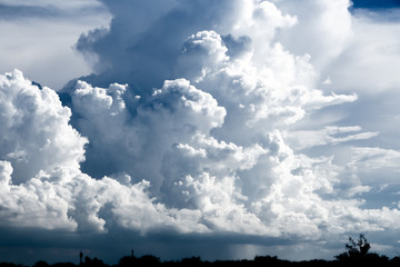 The clouds gather and the blue sky during the rainy season in Thailand.