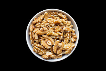 small white dish full of walnuts