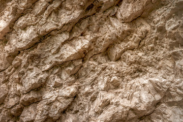 Texture of rough natural stone close up