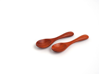  Two wooden spoon isolated on white background.
