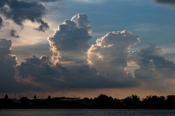 The clouds of black rain gathered in the evening. And evening light in Thailand