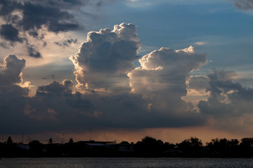 The clouds of black rain gathered in the evening. And evening light in Thailand