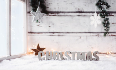 Christmas themed background -nordic style- with concrete letters, froszed window, snow and lot of copy space