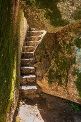 Trails and stairs through granite boulders on Penha Mountain, Portugal.