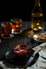 Prosecco pomegranate cocktail, with ice, sugar, garnished with a dry sage leaf. Add 1 ounce of Vodka if you want it stronger