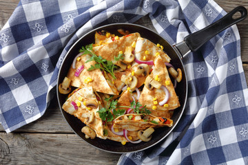 sliced quesadilla with chicken, tomato, sweet corn