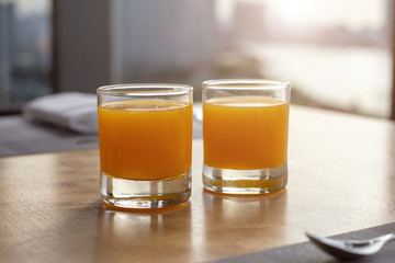 Fresh orange juice on table