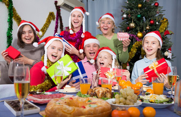 Portrait of happy family who is satisfied of presents in time celebration New Year