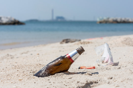 Garbage on a beach, environmental pollution concept picture.